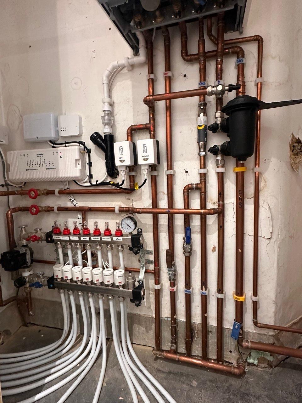 Underfloor heating manifold and copper pipework first fix